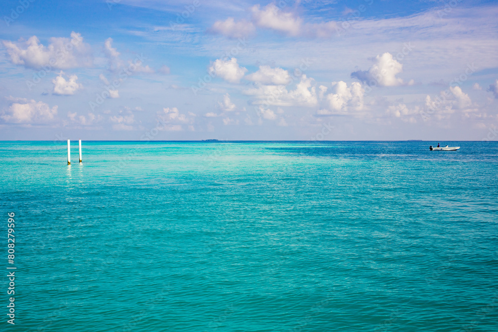 Wall mural background of turquoise sea and blue sky