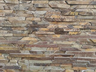 Naklejka premium Photo of natural stone texture. Texture of the wall made of natural stone