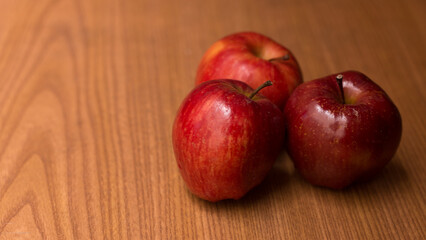 photography of red apples on wooden background