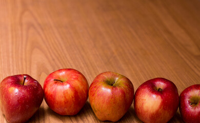 photography of red apples on wooden background