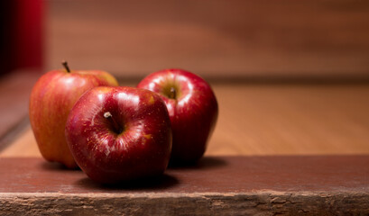 photography of red apples on wooden background