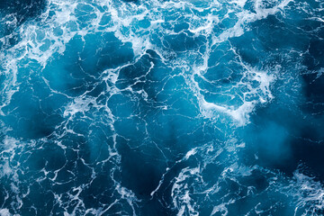 Ocean water background with foam. Ocean water splash. Not a calm