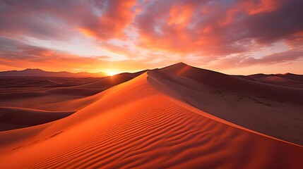 Beautiful panoramic view of sand dunes at sunrise.