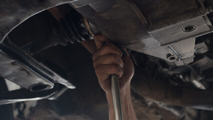 photograph of hands fixing a car, mechanic, vehicle repair