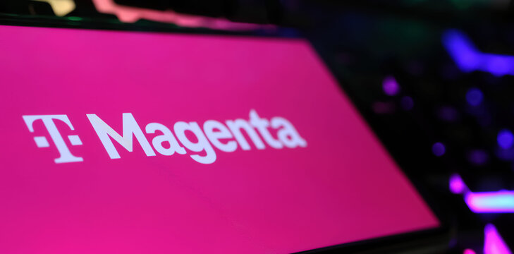 Viersen, Germany - May 1. 2024: Closeup of smartphone with logo lettering of Telekom T Magenta television on computer keyboard