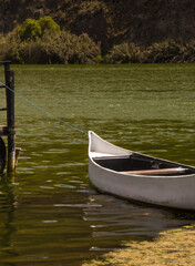 photograph of boat floating on the water of a lake