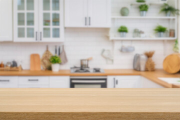 Kitchen wood table top for product display with blurred modern interior. Wooden tabletop over...