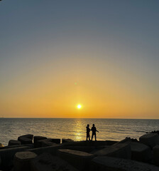 Fototapeta premium Two innocent kids playing and enjoying the sunset