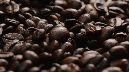 Macro shot of super slow motion shot of fresh coffee bean placed with black background. Close up of...