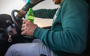 Driver drinks alcohol while driving, crime concept