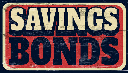 Aged vintage savings bonds sign on wood