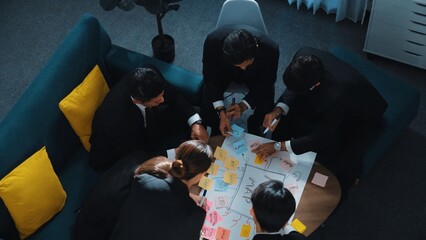 Top view of skilled businesswoman write marketing idea and placed sticky notes on mind mapping...