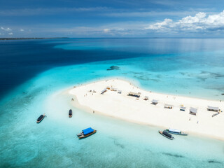 Aerial view of Nakupenda island, sandbank in ocean, white sandy beach, boats, blue sea during low...
