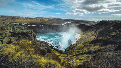 Panoramic summer view of popular tourist destination - Gullfoss waterfall. Dramatic sunrise on Hvita river. Incredible morning scene of Iceland, Europe. Traveling concept background.