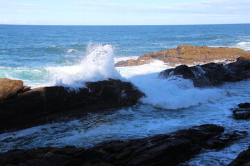 waves crashing on rocks