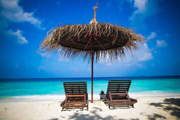 beach chairs on beautiful tropical beach