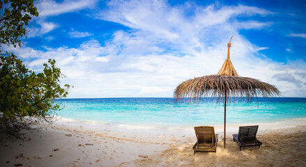 beach chairs on beautiful tropical beach