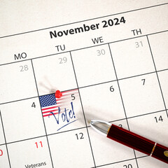 US presidential election will take place on November 5, 2024. A calendar with a pin an US flag and...