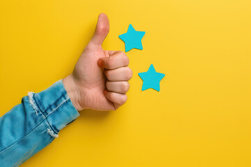 approval concept with thumbs up and three blue stars on yellow background