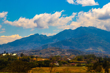 Runway airport city mountains panorama view from airplane Costa Rica.