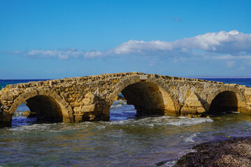 ancient stone bridge in Argassi beach in Zakinthos , Greece
