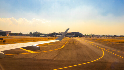 Aircraft at the airport Building and runway Mexico City Mexico.