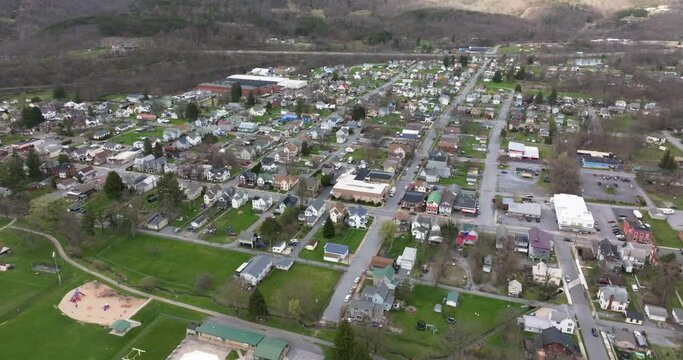 Jersey Shore, PA, USA - 03-17-2024 - Cloudy winter / spring aerial video of the borough, downtown area of Jersey Shore, Pennsylvania.	