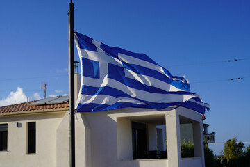 greek flag waving in the air