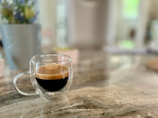 Espresso in clear coffee cup