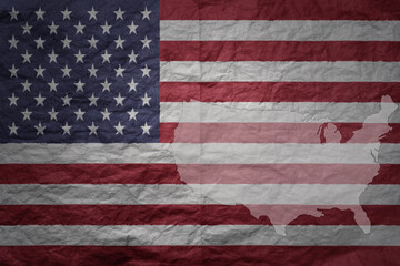 Fototapeta premium big national flag and map of united states of america on a grunge old paper texture background