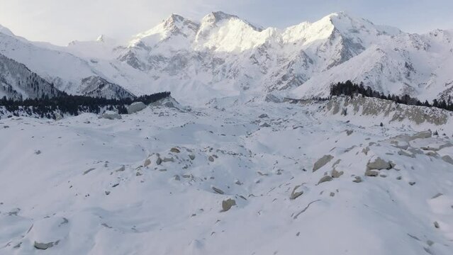 Snowy Nanga Parbat at Winter. Aerial Drone Shot with a glacier in valley, Fairy Meadows Pakistan, Mount Killer at Dawn
