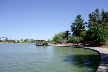 Picnic ramada and water side docking pier gazebo at lake Kiwanis park in Tempe, Arizona