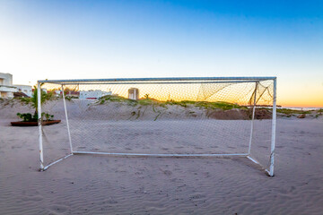 Soccer goal on the beach at sunset in the golden hour on Miramar beach in Tampico Madero 