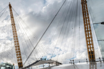 People climbing over roof of The O2 Arena. London (UK)