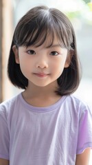 Obraz premium Little beauty girl closeup short black hair looking to camera wearing white dress