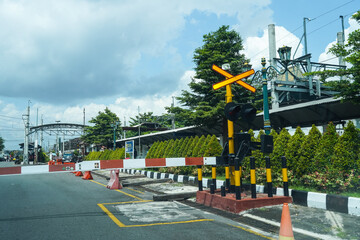 Indonesia, Yogyakarta, April 13, 2024: Railway crossing portal at Tugu station Yogyakarta