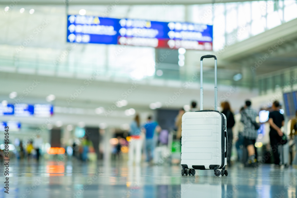 Wall mural Travel, The suitcases in an empty airport hall, traveler cases in the departure airport terminal waiting for the area, vacation concept, blank space for text message or design