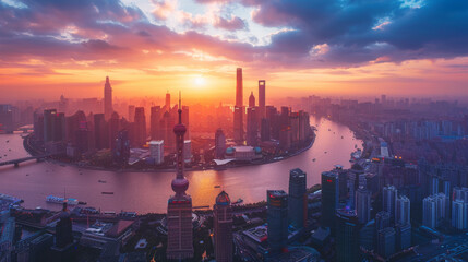 Dramatic aerial view of Shanghai skyline with the Huangpu River glowing under a stunning sunset.