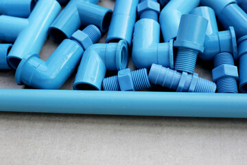 Plumber equipment with blue pvc pipe connections for plumbing work.