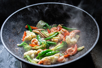 Stir Fry Mixed Vegetables  and shrimp with oyster sauce on pan close up