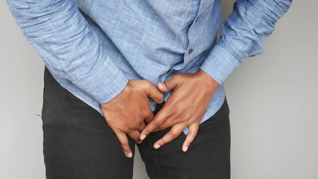 the concept of prostate and bladder problem, crotch pain of a young person 