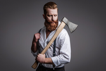 Bearded man hold ax. Hair and beard care. Handsome bearded brutal man. Beard styling. Brutal...