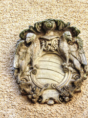 One of coats of arms of former owners of the castle on the outer wall of Konopiste Castle in the Czech Republic