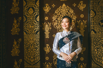 Lao girls dress in traditional Lao clothes. Beautiful Lao girl in Lao dress Asian woman wearing traditional Lao culture