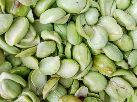 Petai, the bitter bean, twisted cluster bean or stink bean (Parkia speciosa). Bitter bean texture background.