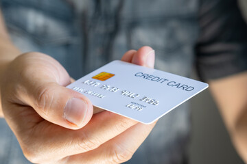 Man holding several credit cards and he is choosing a credit card to pay and spend Payment for...