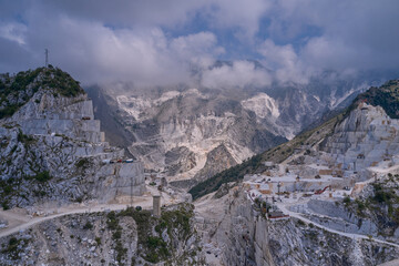 Marble quarry top view. Winding road to the marble quarry. Aerial panorama of marble quarries Carrara Italy. Aerial panorama on the Carrara marble quarry.