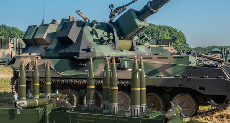 Guided 155 mm artillery ammunition on a howitzer battle position