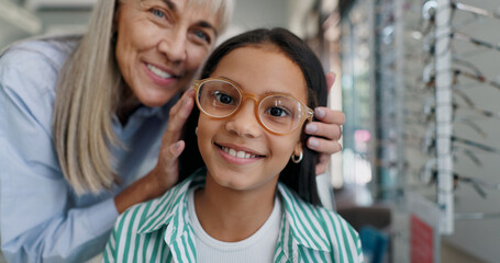 Shopping, glasses or face of child with doctor for eye care, retail and vision for help or choice....