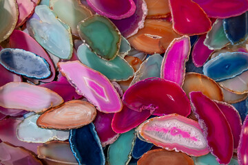 Close up view of many colorful Agate crystal slices up for sale.